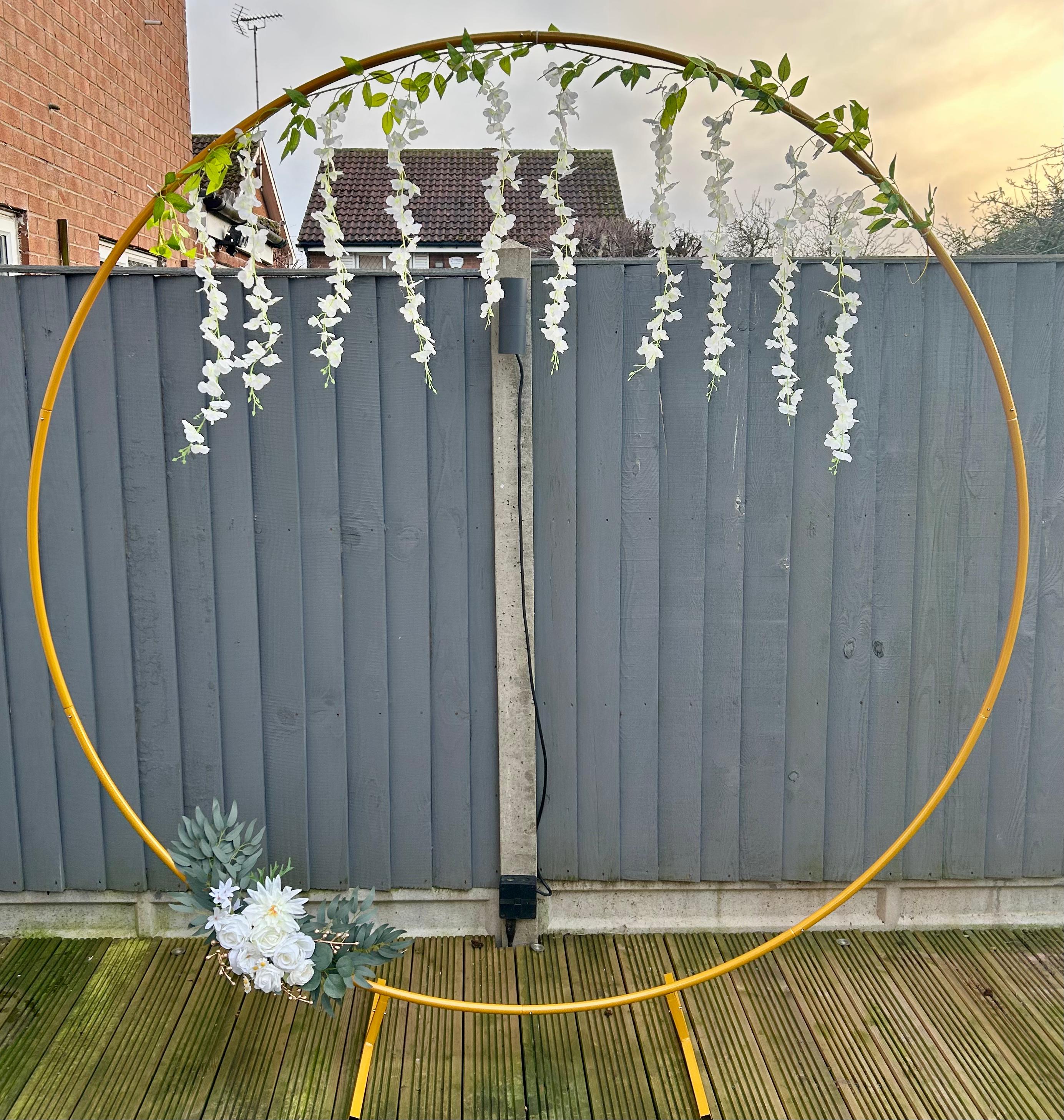 Gold moongate arch with wisteria and floral garland